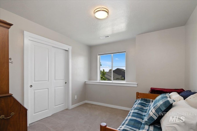 1123 Drexel Hill Ave, Caldwell, ID 83605 - bedroom featuring light colored carpet, baseboards, and a closet