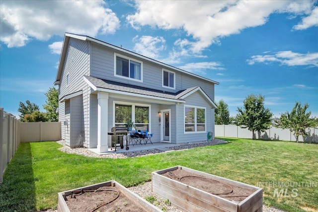 1123 Drexel Hill Ave, Caldwell, ID 83605 - rear view of house featuring a garden, a patio area, and a shingled roof