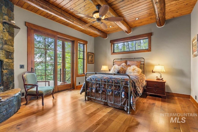 370 Blackhawk Lake Dr, Mccall, ID 83638 - bedroom with wood ceiling with exposed beams, wood-type flooring, access to exterior, and multiple windows