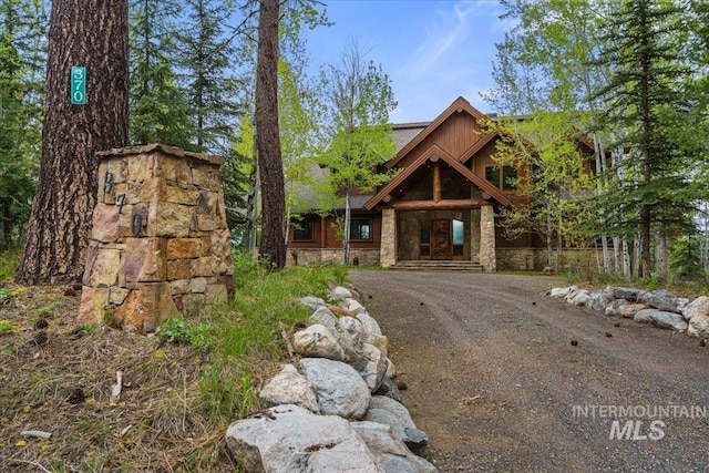 370 Blackhawk Lake Dr, Mccall, ID 83638 - view of front of house with stone siding and driveway