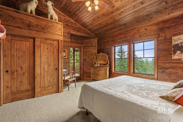 370 Blackhawk Lake Dr, Mccall, ID 83638 - carpeted bedroom featuring access to exterior, lofted ceiling, wood walls, and wooden ceiling