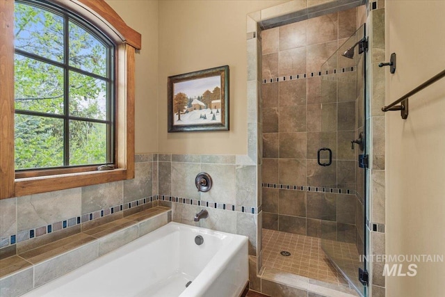 370 Blackhawk Lake Dr, Mccall, ID 83638 - full bathroom with a garden tub and a stall shower