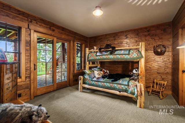 370 Blackhawk Lake Dr, Mccall, ID 83638 - carpeted bedroom featuring wooden walls and access to outside