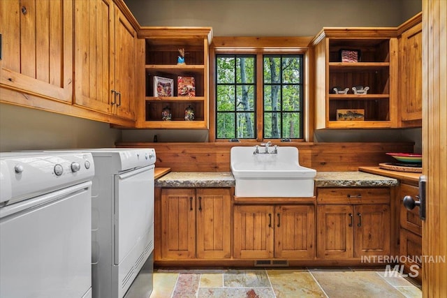 370 Blackhawk Lake Dr, Mccall, ID 83638 - washroom with cabinet space, independent washer and dryer, and light stone finish floors
