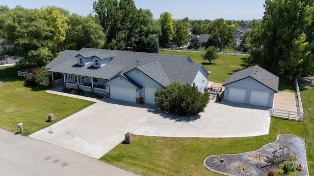 4019 E Man O War Dr, Nampa, ID 83686 - view of front facade with an outdoor structure, a shingled roof, a porch, and driveway