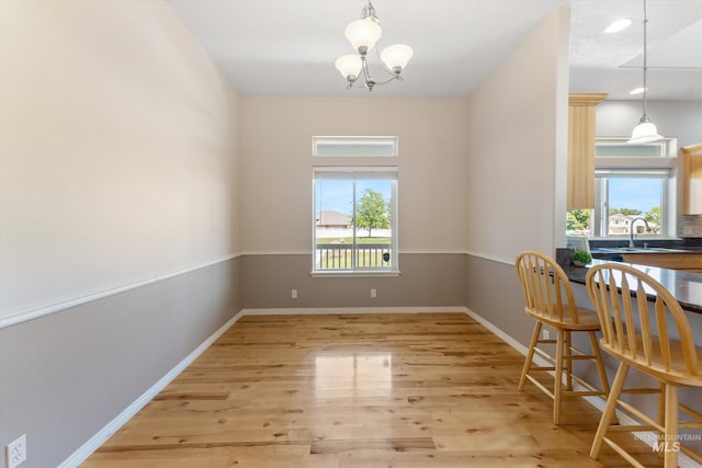 4019 E Man O War Dr, Nampa, ID 83686 - dining area featuring a chandelier and light wood-style flooring