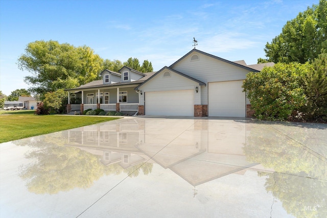 4019 E Man O War Dr, Nampa, ID 83686 - view of front of house featuring a porch, a front lawn, an attached garage, driveway, and brick siding