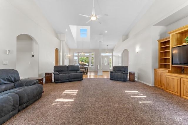 4019 E Man O War Dr, Nampa, ID 83686 - carpeted living room featuring ceiling fan, high vaulted ceiling, and arched walkways