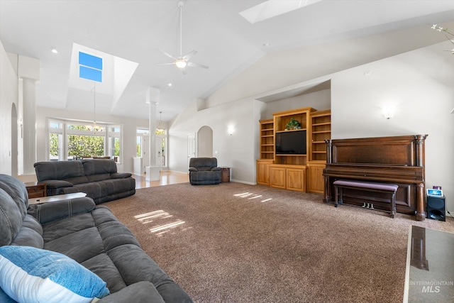 4019 E Man O War Dr, Nampa, ID 83686 - living room with arched walkways, carpet, a ceiling fan, a skylight, and high vaulted ceiling