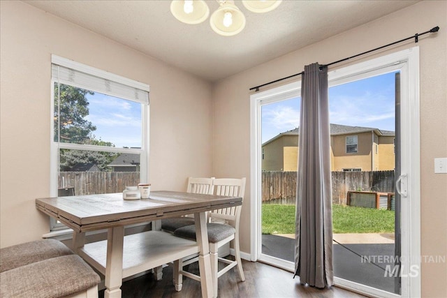 9308 W Rustica Dr, Boise, ID 83709 - dining area featuring wood finished floors and a chandelier