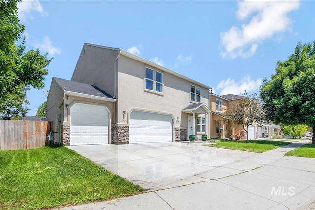 9308 W Rustica Dr, Boise, ID 83709 - view of front of home with driveway, stone siding, a garage, and stucco siding
