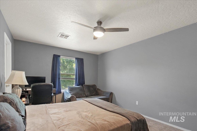 9308 W Rustica Dr, Boise, ID 83709 - bedroom featuring carpet, a ceiling fan, and a textured ceiling