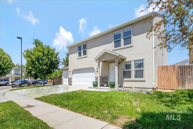 9308 W Rustica Dr, Boise, ID 83709 - view of front facade with an attached garage, driveway, stucco siding, and stone siding