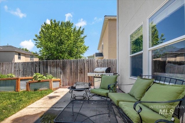 9308 W Rustica Dr, Boise, ID 83709 - fenced backyard with a patio, an outdoor hangout area, and grilling area