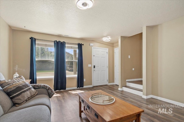 9308 W Rustica Dr, Boise, ID 83709 - living room with wood finished floors and a textured ceiling