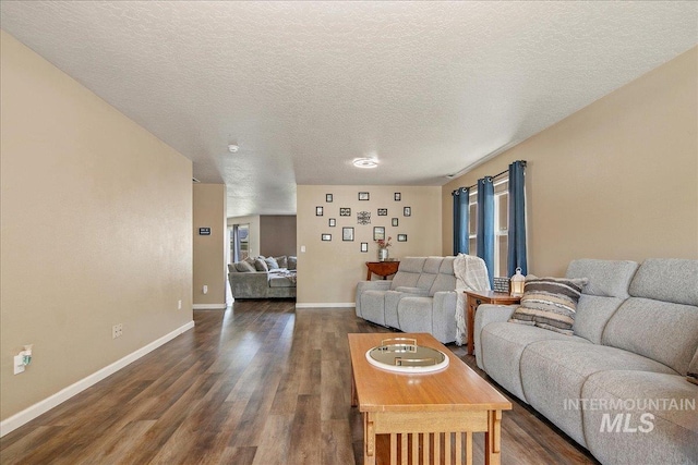 9308 W Rustica Dr, Boise, ID 83709 - living room featuring dark wood-type flooring and a textured ceiling