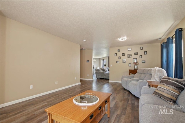 9308 W Rustica Dr, Boise, ID 83709 - living room featuring dark wood-style floors and a textured ceiling