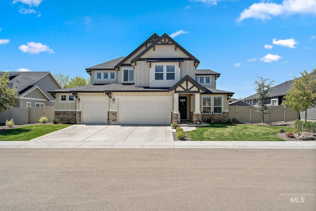 2245 N Burnam Ave, Star, ID 83669 - craftsman house with driveway, a front yard, fence, an attached garage, and stone siding