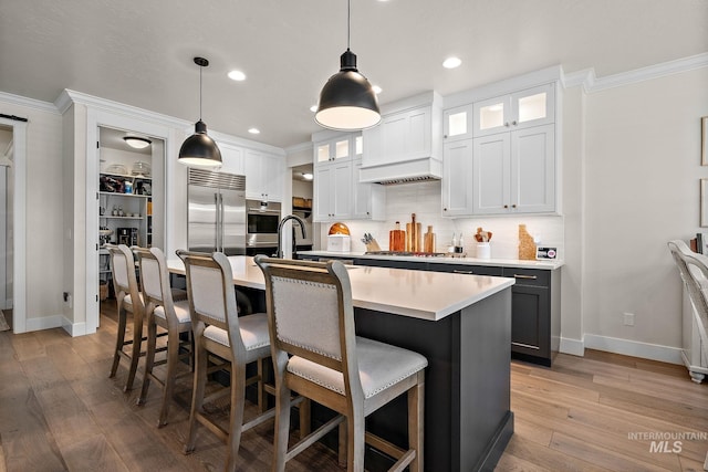 2245 N Burnam Ave, Star, ID 83669 - kitchen featuring baseboards, ornamental molding, and stainless steel appliances