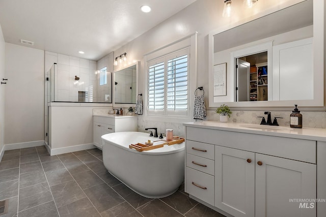 2245 N Burnam Ave, Star, ID 83669 - bathroom with a sink, a freestanding tub, tiled shower, and visible vents