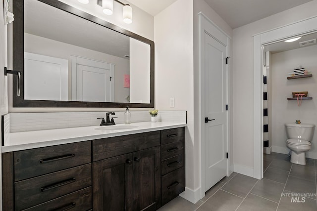 2245 N Burnam Ave, Star, ID 83669 - full bath featuring visible vents, tile patterned flooring, vanity, toilet, and baseboards