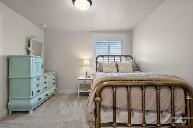 2245 N Burnam Ave, Star, ID 83669 - bedroom featuring light colored carpet, baseboards, and visible vents