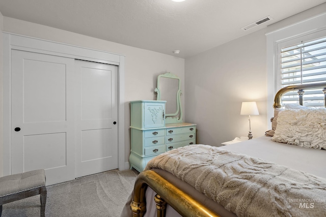 2245 N Burnam Ave, Star, ID 83669 - bedroom featuring light colored carpet, visible vents, and a closet
