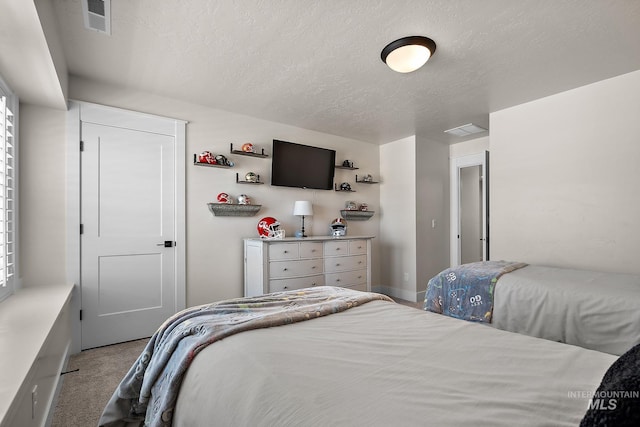 2245 N Burnam Ave, Star, ID 83669 - bedroom featuring a textured ceiling, visible vents, and carpet