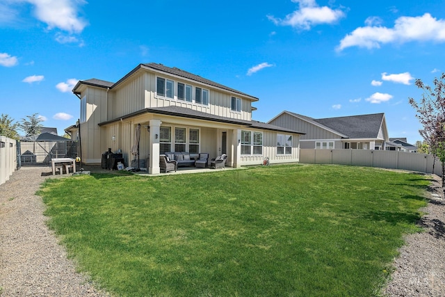 2245 N Burnam Ave, Star, ID 83669 - rear view of house with an outdoor hangout area, board and batten siding, a lawn, and a fenced backyard
