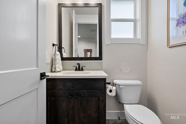 2245 N Burnam Ave, Star, ID 83669 - bathroom featuring vanity, backsplash, toilet, and visible vents