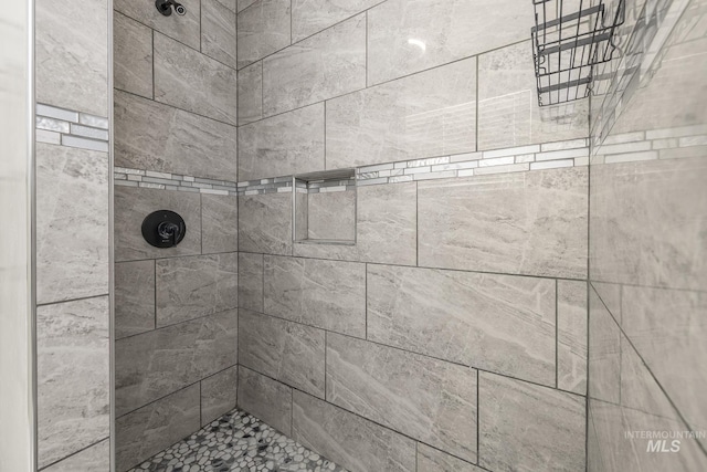 full bathroom with tiled shower