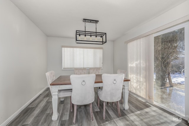 dining room with dark wood-style floors and baseboards