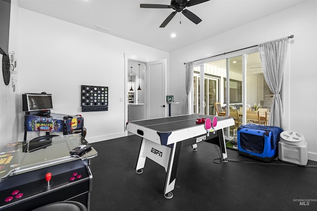 recreation room with rubber floors, a ceiling fan, baseboards, and recessed lighting