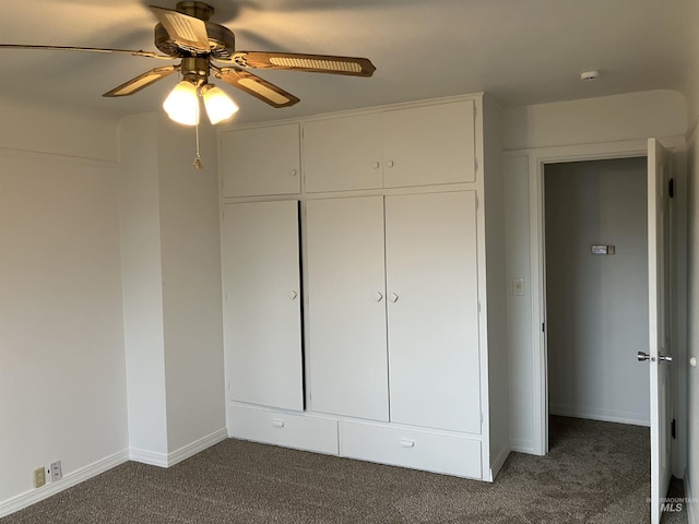 unfurnished bedroom featuring baseboards, a closet, carpet floors, and ceiling fan