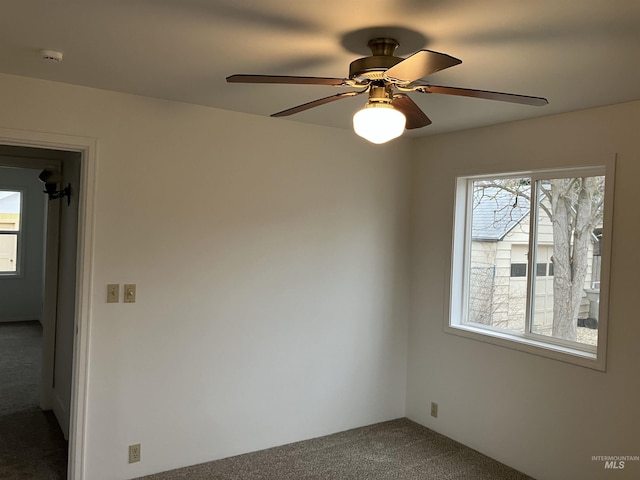 carpeted empty room with ceiling fan