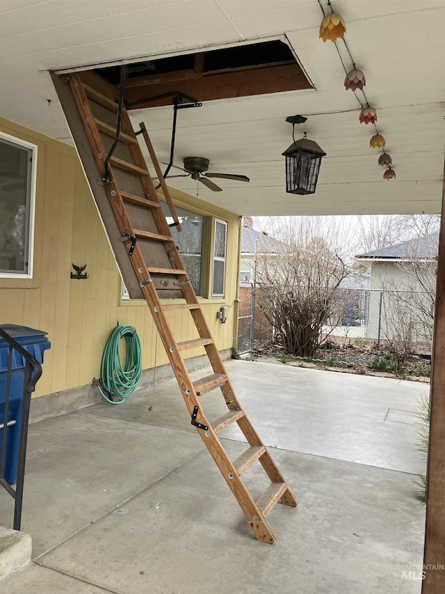 view of patio with a ceiling fan and fence