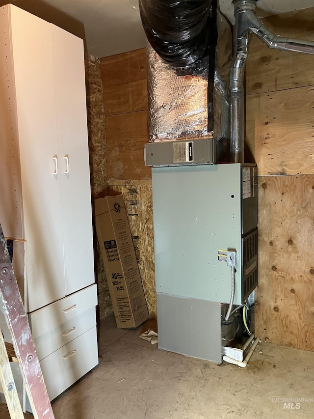 utility room featuring heating unit