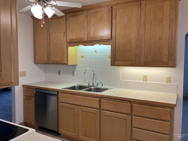 kitchen with ceiling fan, a sink, light countertops, stainless steel dishwasher, and tasteful backsplash