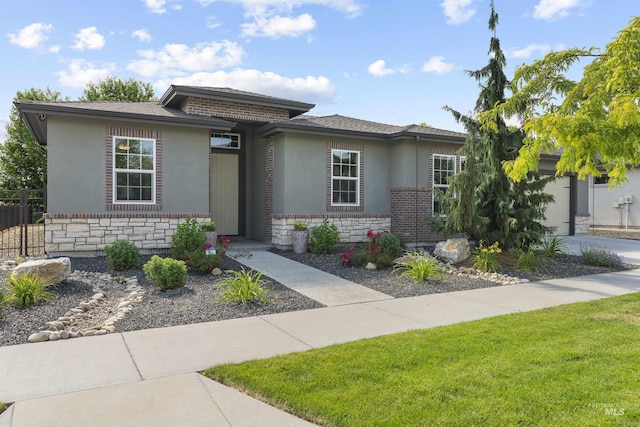 1747 N Tuscolano Ave, Eagle, ID 83616 - prairie-style house with stone siding, stucco siding, and a garage