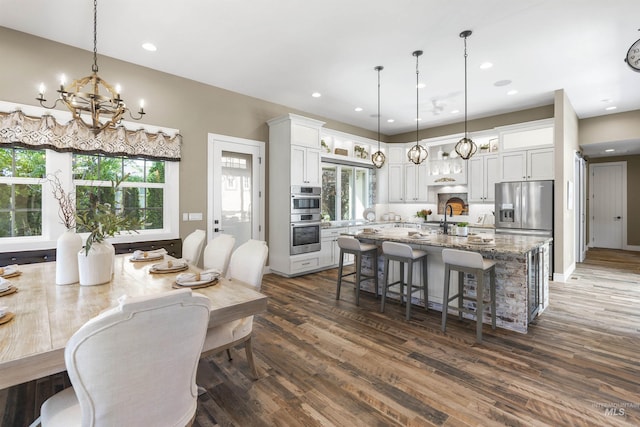 1747 N Tuscolano Ave, Eagle, ID 83616 - dining space featuring a chandelier, dark wood-style flooring, and recessed lighting