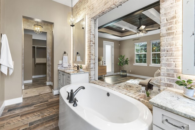 1747 N Tuscolano Ave, Eagle, ID 83616 - bathroom featuring wood finished floors, vanity, ceiling fan, and a garden tub