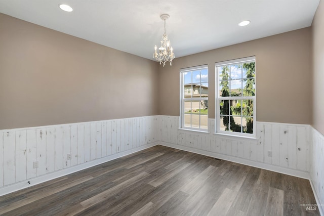 1747 N Tuscolano Ave, Eagle, ID 83616 - unfurnished room featuring a wainscoted wall, a chandelier, dark wood finished floors, and recessed lighting