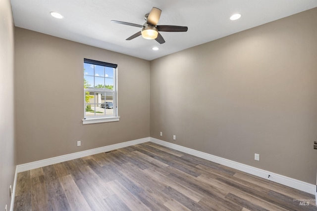 1747 N Tuscolano Ave, Eagle, ID 83616 - spare room featuring ceiling fan, dark wood-type flooring, and recessed lighting