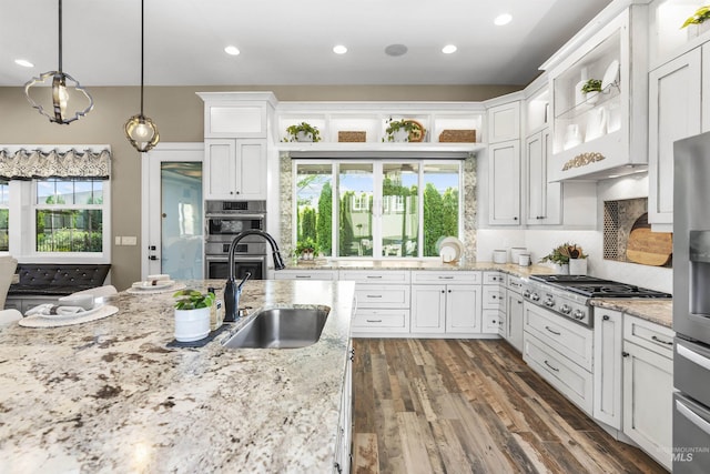 1747 N Tuscolano Ave, Eagle, ID 83616 - kitchen featuring stainless steel appliances, plenty of natural light, tasteful backsplash, white cabinetry, and recessed lighting