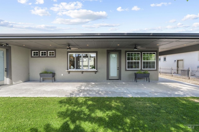 1747 N Tuscolano Ave, Eagle, ID 83616 - back of property featuring a ceiling fan, stucco siding, and a patio area