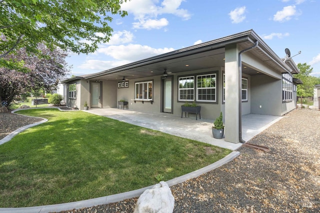1747 N Tuscolano Ave, Eagle, ID 83616 - back of house with stucco siding, ceiling fan, and a patio area