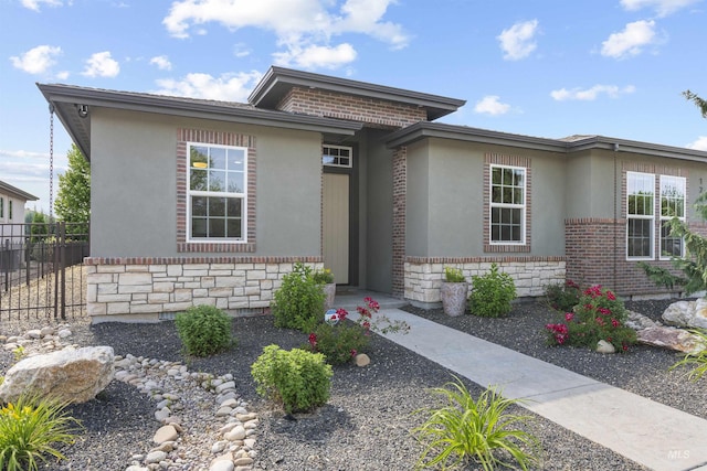 1747 N Tuscolano Ave, Eagle, ID 83616 - prairie-style home with brick siding, stucco siding, and stone siding