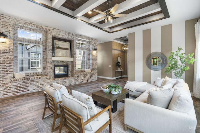 1747 N Tuscolano Ave, Eagle, ID 83616 - living area featuring brick wall, wood finished floors, ceiling fan, an accent wall, and beamed ceiling