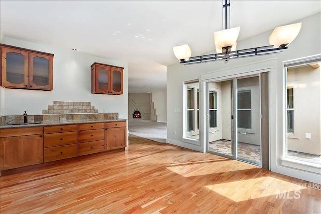 unfurnished dining area featuring light wood finished floors