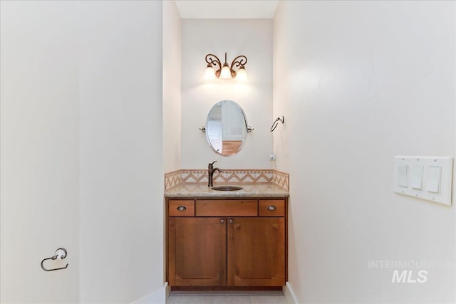bathroom featuring vanity and baseboards